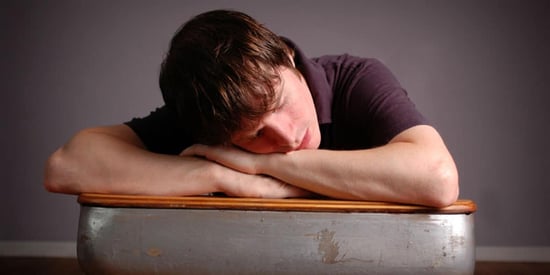 student-sleeping-on-desk